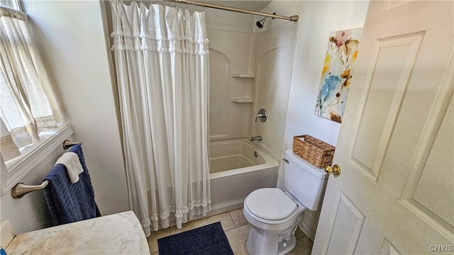 bathroom featuring toilet, tile patterned floors, and shower / bath combo with shower curtain