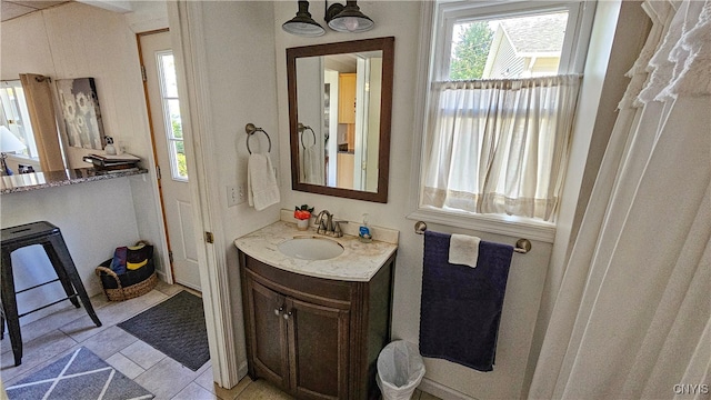 bathroom featuring vanity and tile patterned flooring