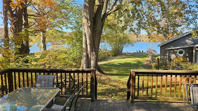 wooden deck with a lawn