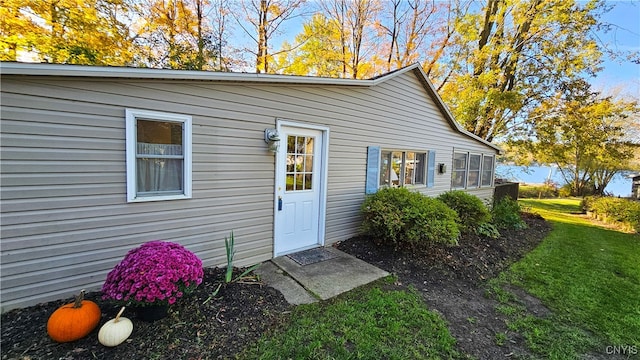 view of outbuilding with a lawn