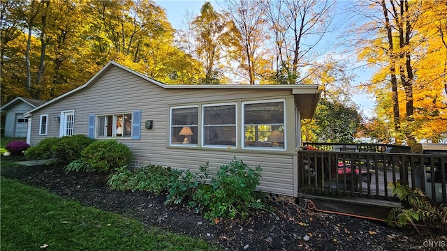 view of side of home featuring a deck