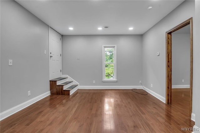 spare room with hardwood / wood-style floors