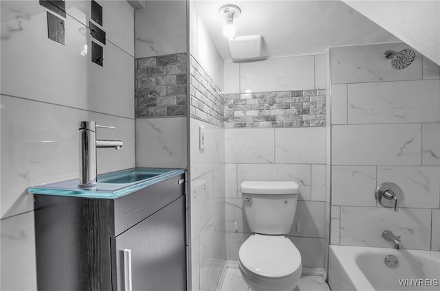 767 W Ave, Buffalo, NY 14213 - full bathroom with toilet, tile walls, bathing tub / shower combination, vanity, and marble finish floors