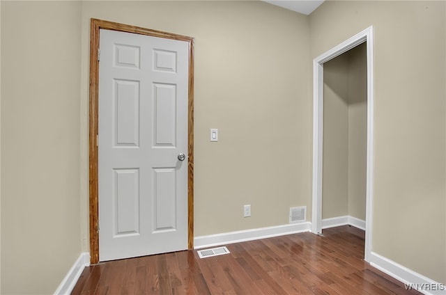 unfurnished bedroom featuring hardwood / wood-style flooring