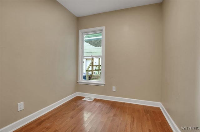 spare room featuring light wood-type flooring