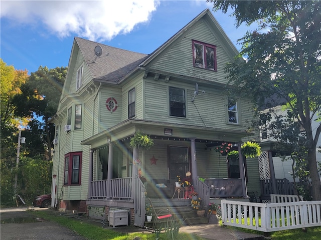 victorian-style house featuring a porch