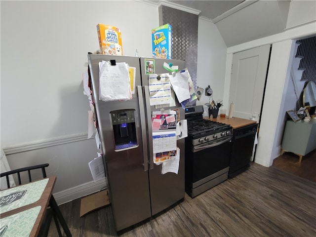 kitchen with appliances with stainless steel finishes, ornamental molding, dark wood-type flooring, and vaulted ceiling