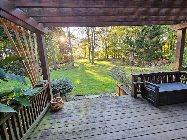 wooden terrace featuring a pergola and a yard