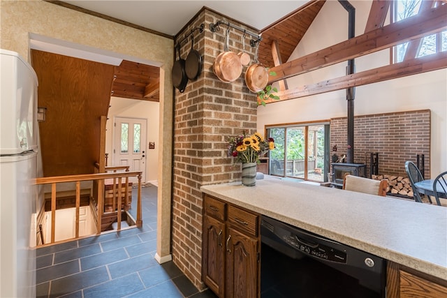 kitchen featuring dishwasher, plenty of natural light, and white refrigerator