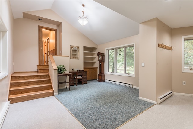 carpeted entrance foyer with lofted ceiling and a baseboard heating unit