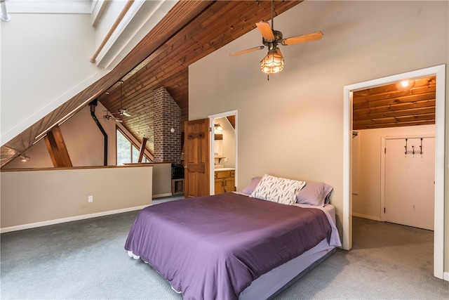 bedroom with high vaulted ceiling, ensuite bath, carpet floors, and ceiling fan