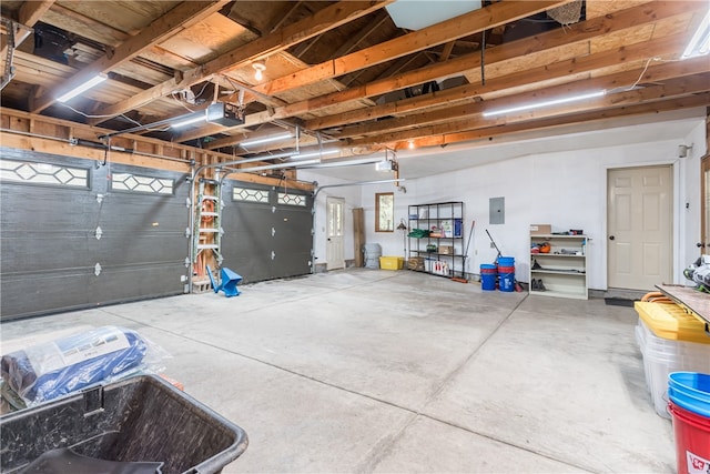 garage featuring a garage door opener and electric panel