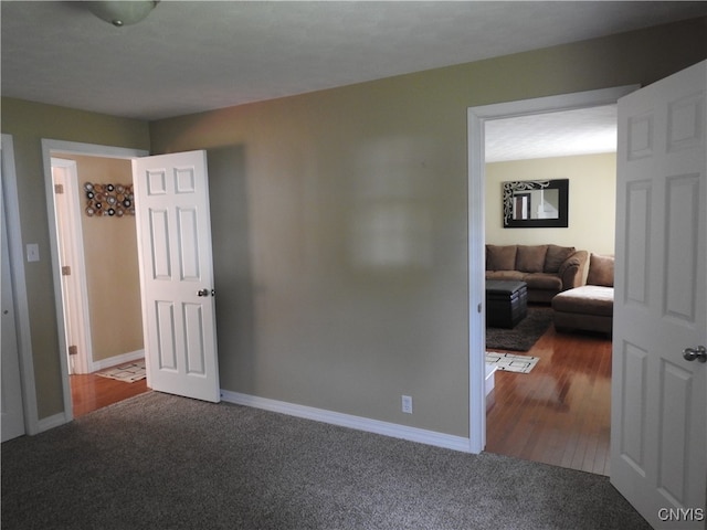 bedroom with dark hardwood / wood-style flooring