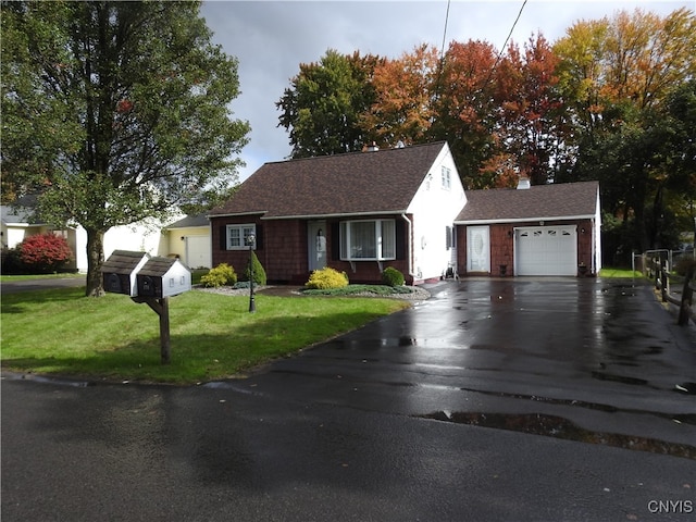 view of front of home featuring a front lawn and a garage