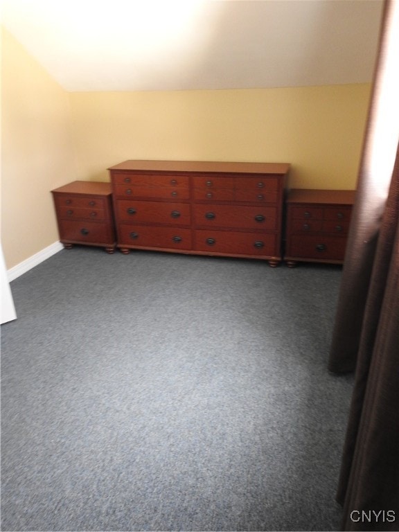 bedroom with dark colored carpet