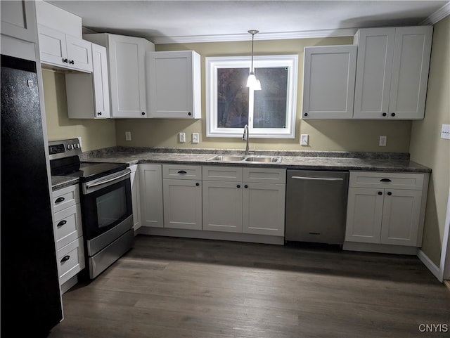 kitchen with white cabinetry, appliances with stainless steel finishes, sink, and pendant lighting