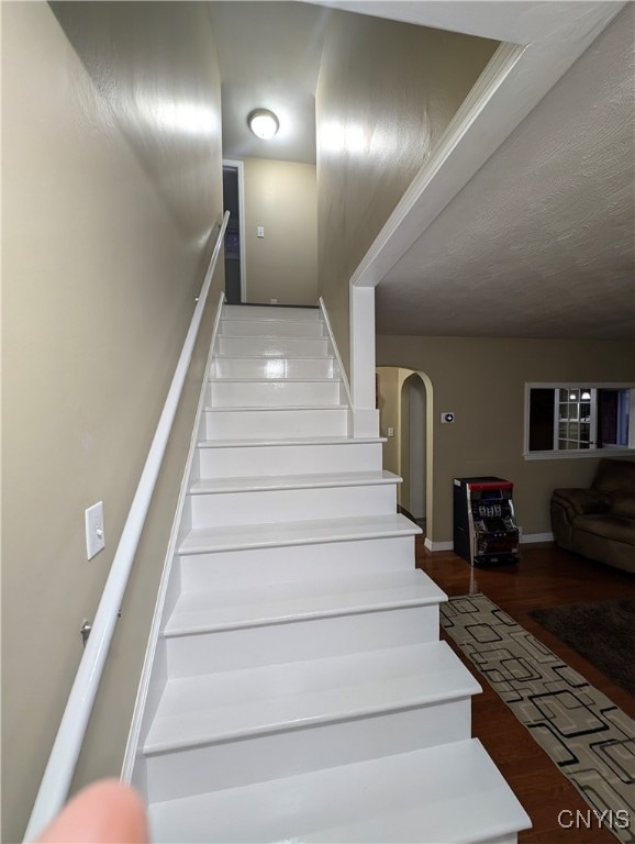 stairs with hardwood / wood-style floors