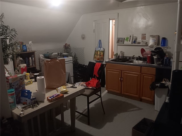 home office featuring vaulted ceiling and sink