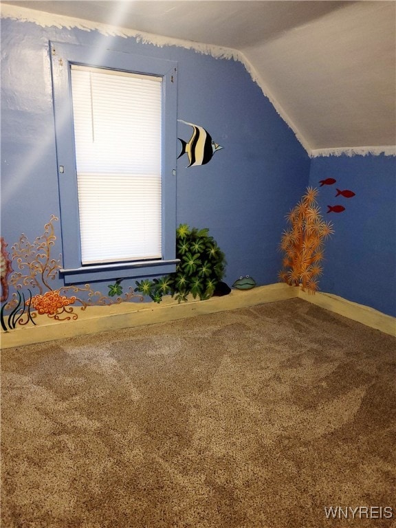 bonus room featuring vaulted ceiling and carpet floors