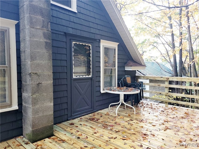 property entrance featuring a wooden deck