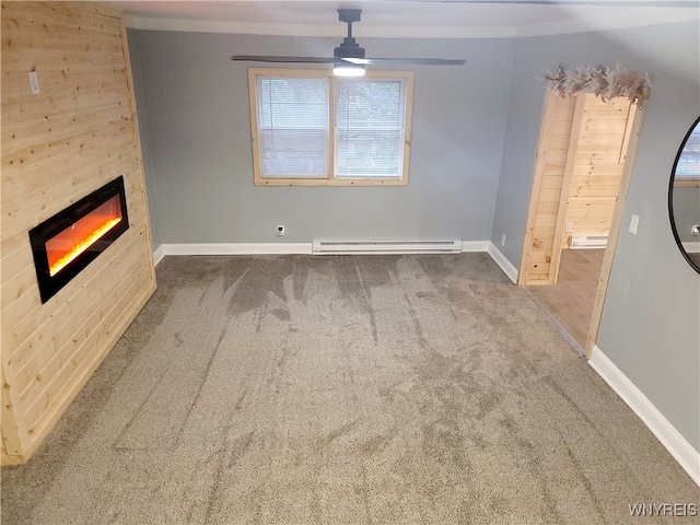 unfurnished living room featuring a baseboard radiator, ceiling fan, and carpet floors