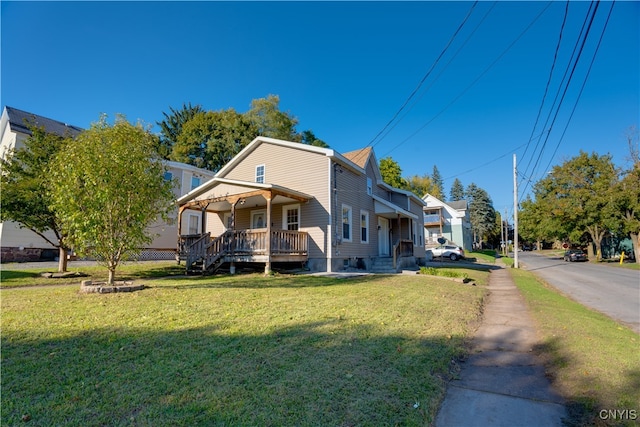 view of front of home with a front yard and covered porch