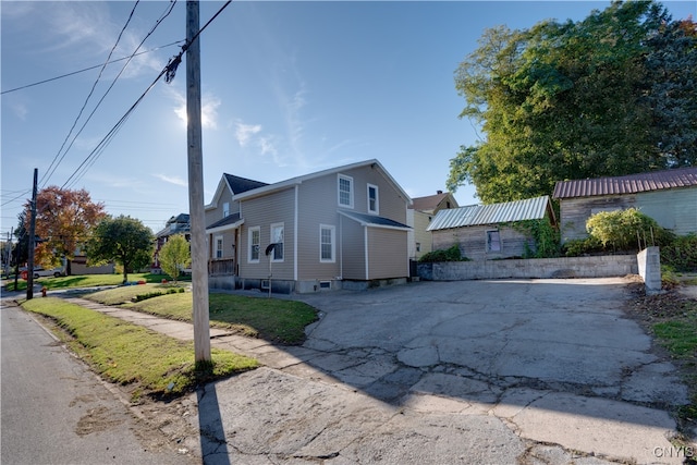 view of side of property with a yard