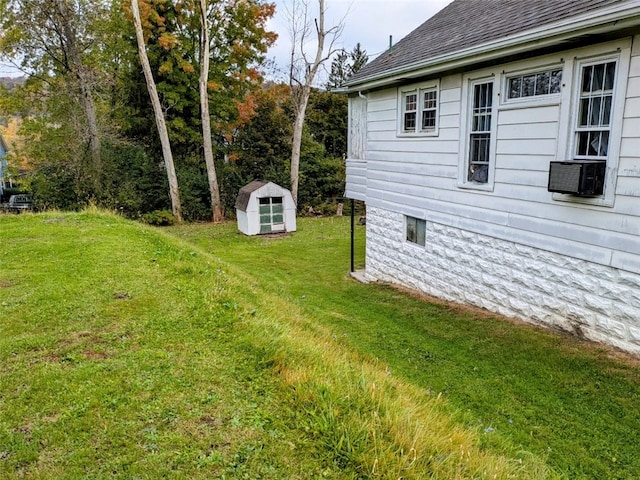 view of yard featuring a storage unit and cooling unit