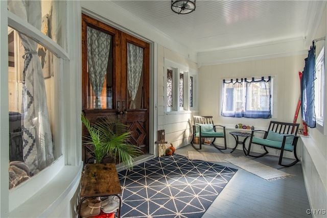 living area featuring hardwood / wood-style floors and french doors