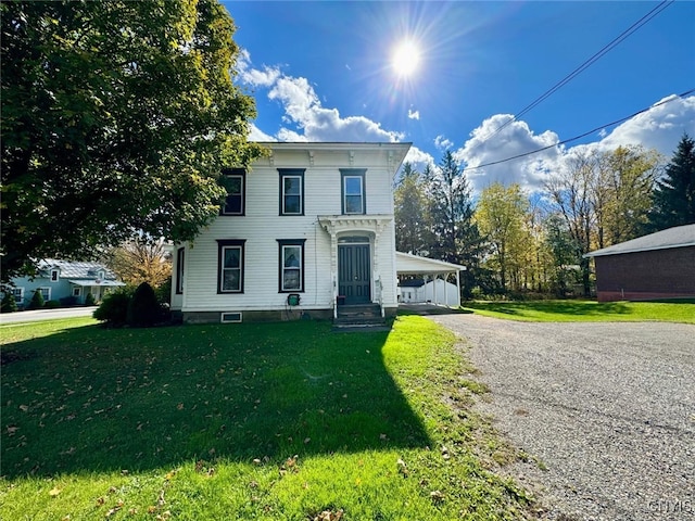 italianate home featuring a front yard