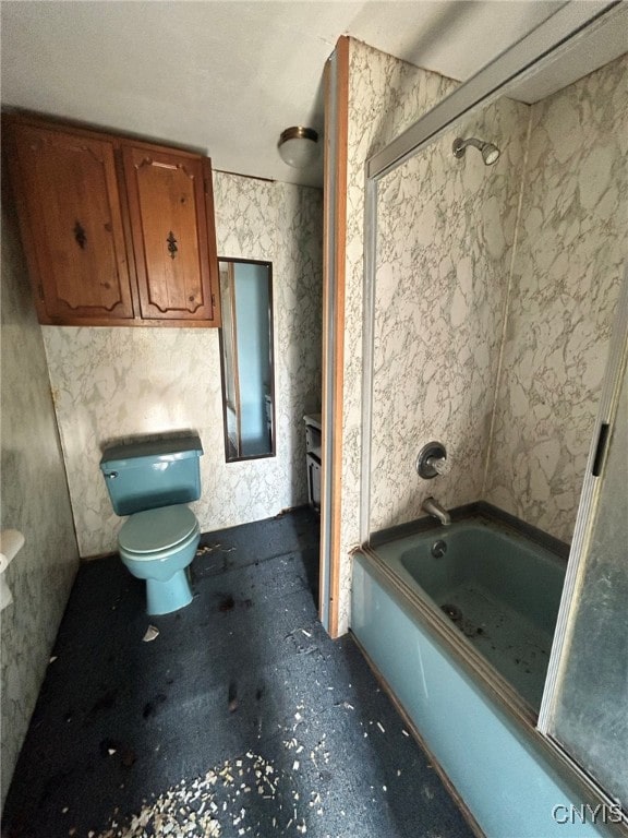 bathroom featuring shower / bathing tub combination and toilet