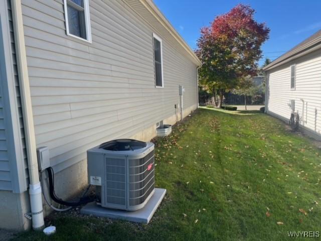 view of yard featuring central air condition unit