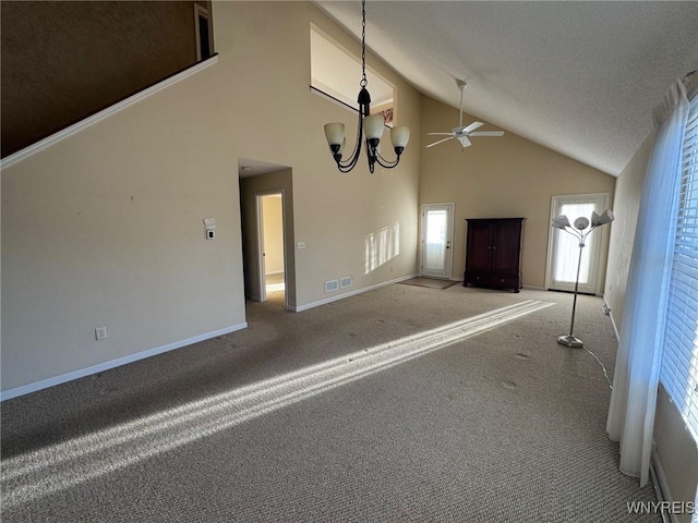 interior space with carpet floors, a notable chandelier, visible vents, a textured ceiling, and baseboards