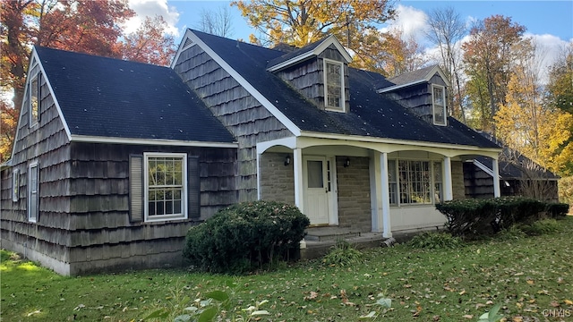 exterior space with a lawn and a porch