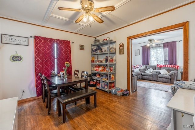 dining area with ceiling fan, crown molding, and hardwood / wood-style floors