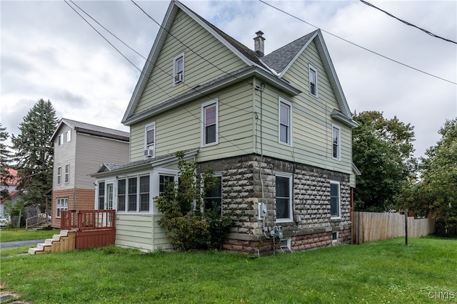 back of house with a yard