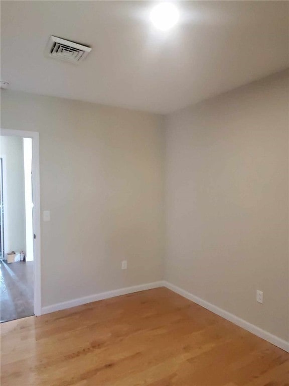 unfurnished room with light hardwood / wood-style flooring