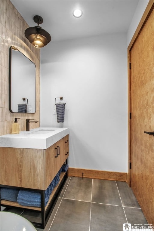 bathroom featuring vanity and tile patterned flooring