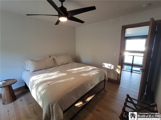 bedroom featuring ceiling fan and hardwood / wood-style flooring