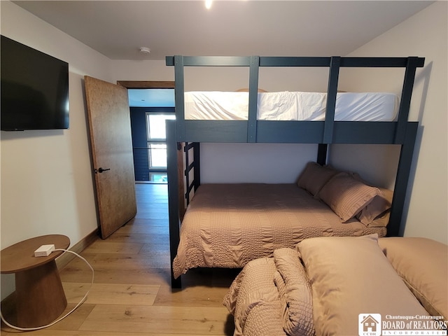 bedroom with light wood-type flooring