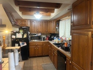 kitchen featuring dishwasher, beam ceiling, sink, and light tile patterned floors