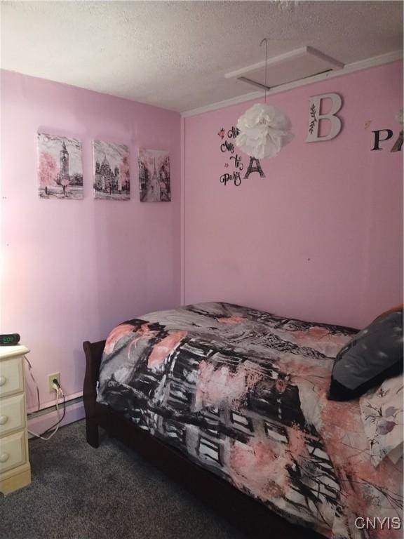 bedroom with carpet floors, a baseboard radiator, and a textured ceiling