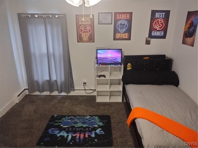 carpeted bedroom featuring a baseboard heating unit