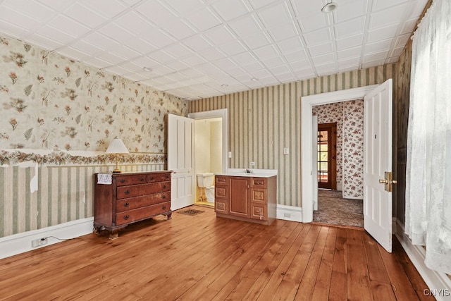 unfurnished bedroom featuring hardwood / wood-style flooring