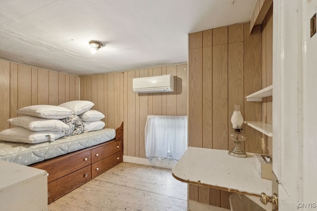 interior space featuring wooden walls and a wall unit AC