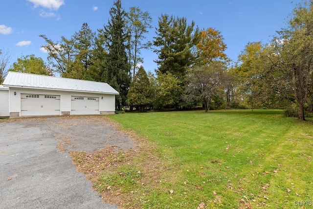 view of yard with a garage