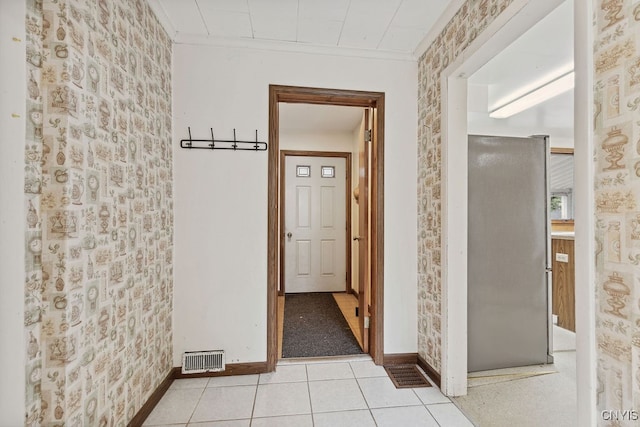 hall featuring light tile patterned flooring