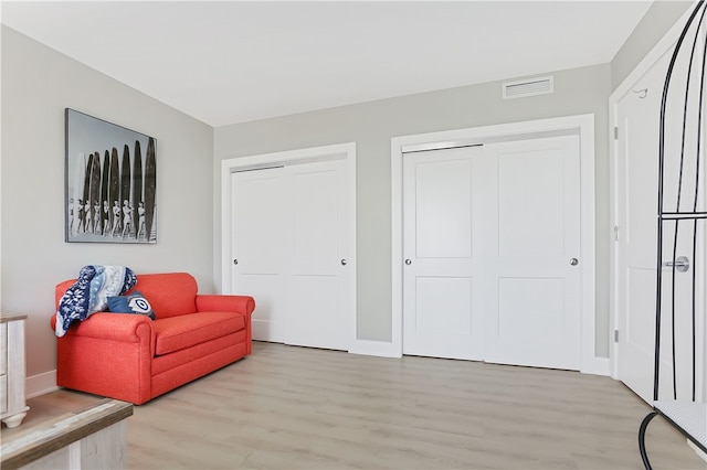 living area with light hardwood / wood-style flooring