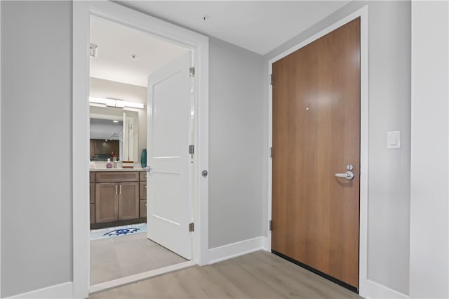 hall with light hardwood / wood-style floors