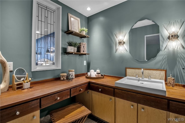 bathroom featuring vanity and decorative backsplash